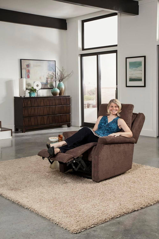 Woman relaxing in a Metro Lift Chair Rental, a comfortable power recliner in a modern living space.