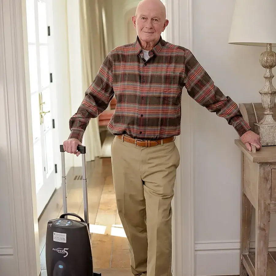 SeQual Eclipse 5 oxygen concentrator - Two Battery Package in a home setting.